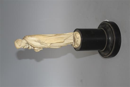 A 19th century Dieppe carved ivory figure of St Joseph holding the Christ child, 16cm, on ebony socle, overall height 26.5cm